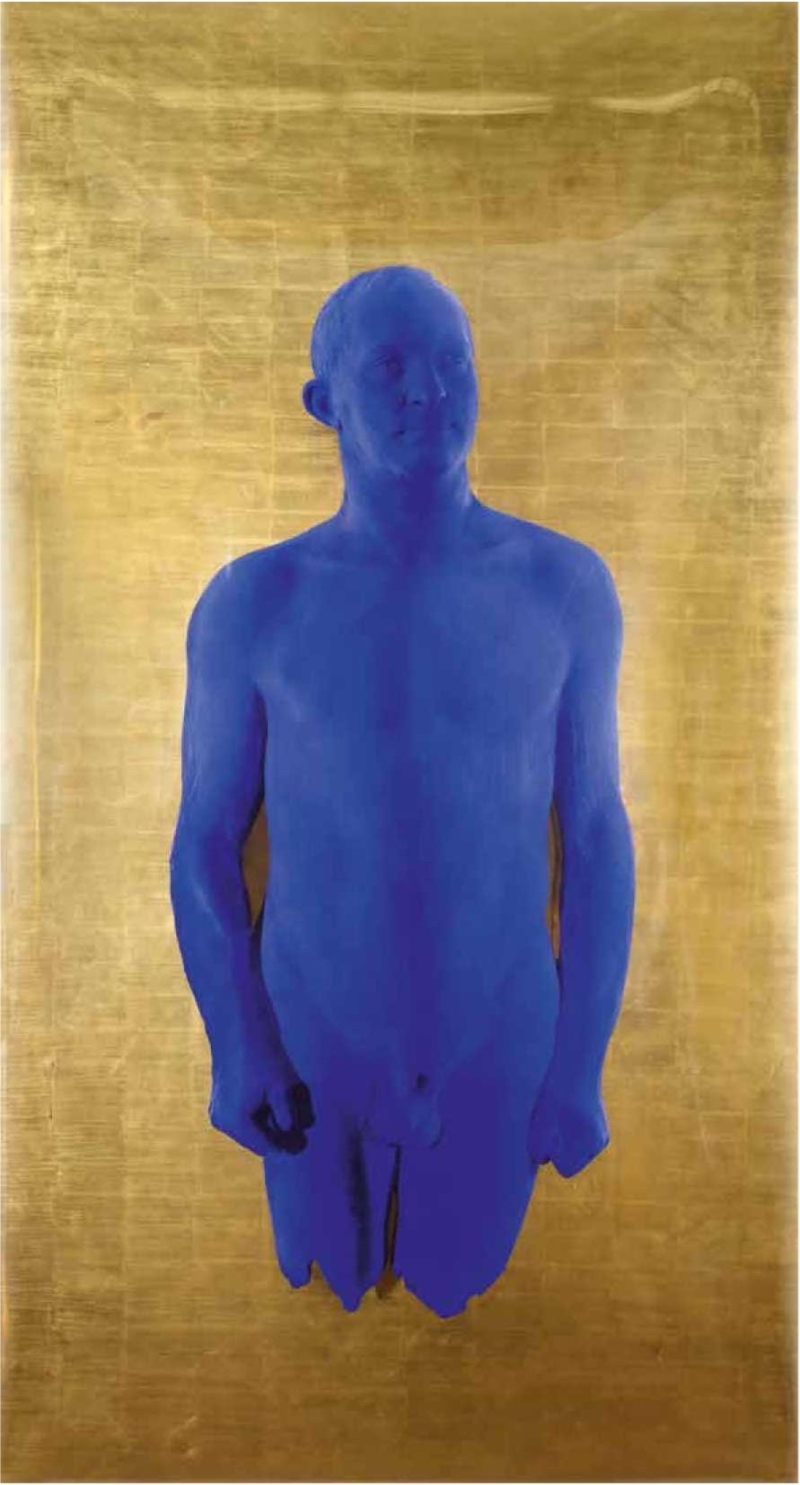 A blue, nude male figure stands against a shimmering gold background, arms relaxed at his sides.